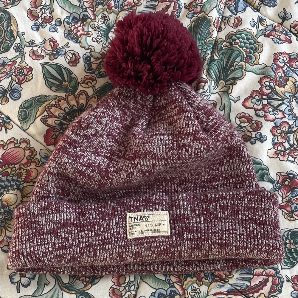 TNA women’s Burgundy Knit Beanie with Pom-Pom